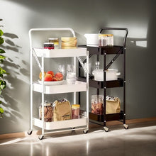 Cargar imagen en el visor de la galería, Carrito de Almacenamiento Multifuncional de Metal Plegable con 3 Niveles y Ruedas – Blanco o Negro