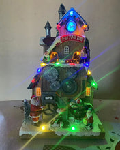 Cargar imagen en el visor de la galería, ESCENA FABRICA SANTA CON MUSICA LUZ LED MOVIMIENTO 13.5x16.5x29 cm