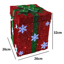 Cargar imagen en el visor de la galería, Papá Noel Saliendo de Caja Decorativo con Luz, Movimiento y Múltiples Melodías Navideñas - 26x26x32 cm, Diseños en Oro (Lazo Rojo) y Rojo (Lazo Verde o Dorado al Azar), Interruptor de Botón y Pilas AA No Incluidas
