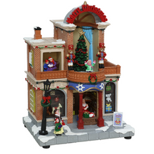 Cargar imagen en el visor de la galería, Villa Navideña LED con Música y Movimiento Decorativa, casa de Navidad iluminada – 25 Luces Multicolor, 8 Melodías de Navidad, 20,5 × 15 × 28,5 cm
