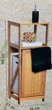 Cargar imagen en el visor de la galería, Mueble de bambú con cesto para ropa sucia.
